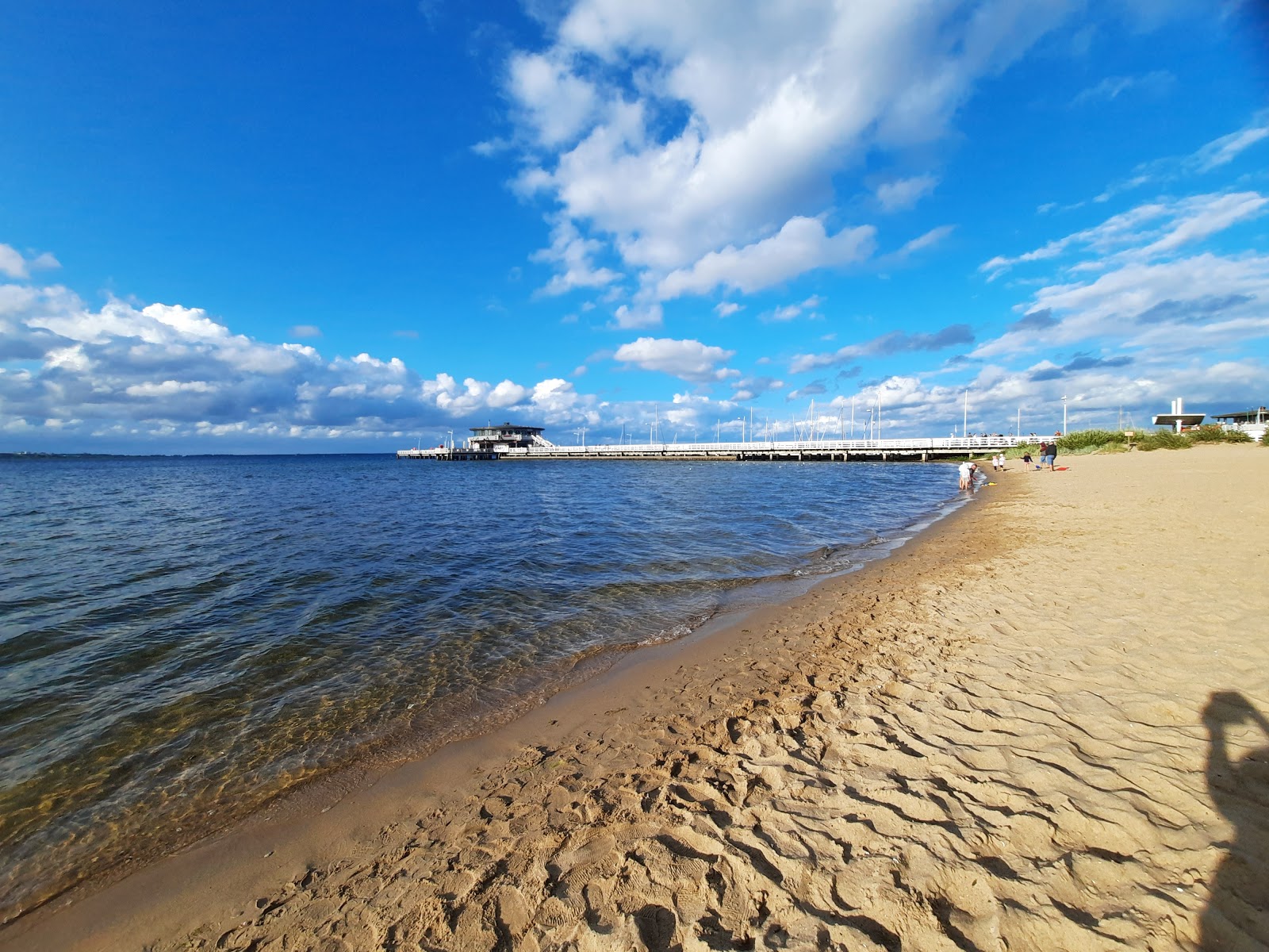 Foto van Zielona Beach met helder zand oppervlakte