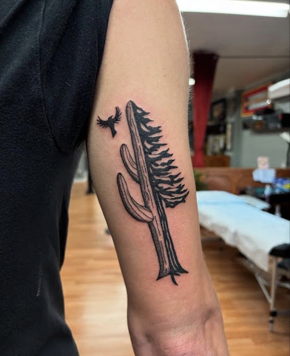 Explore bow hunting tattoo ideas, creative tattoo ideas in Tucson, available at The Painted Lady Tattoo