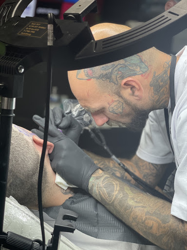 Explore memorial cross tattoo ideas, creative tattoo ideas in Las Vegas, available at Inky Dragon Tattoo Club