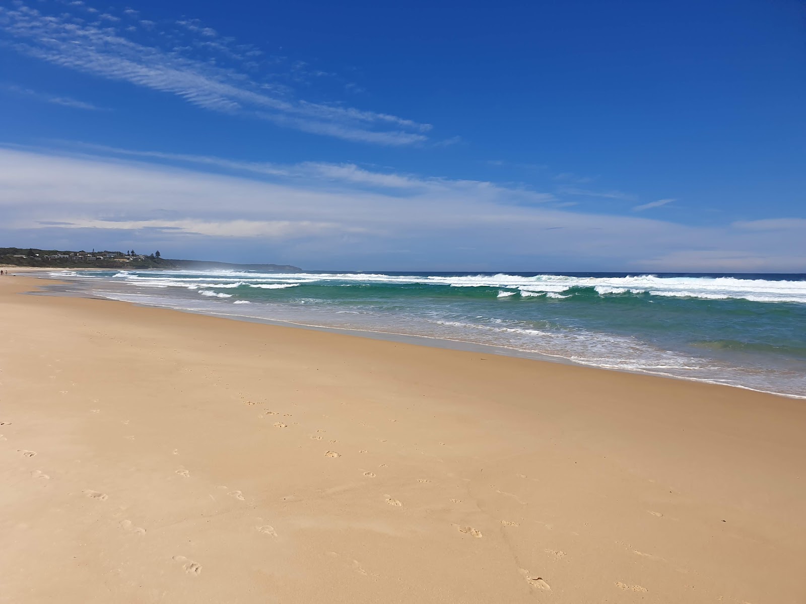 Fotografija Racecourse Beach z dolga ravna obala