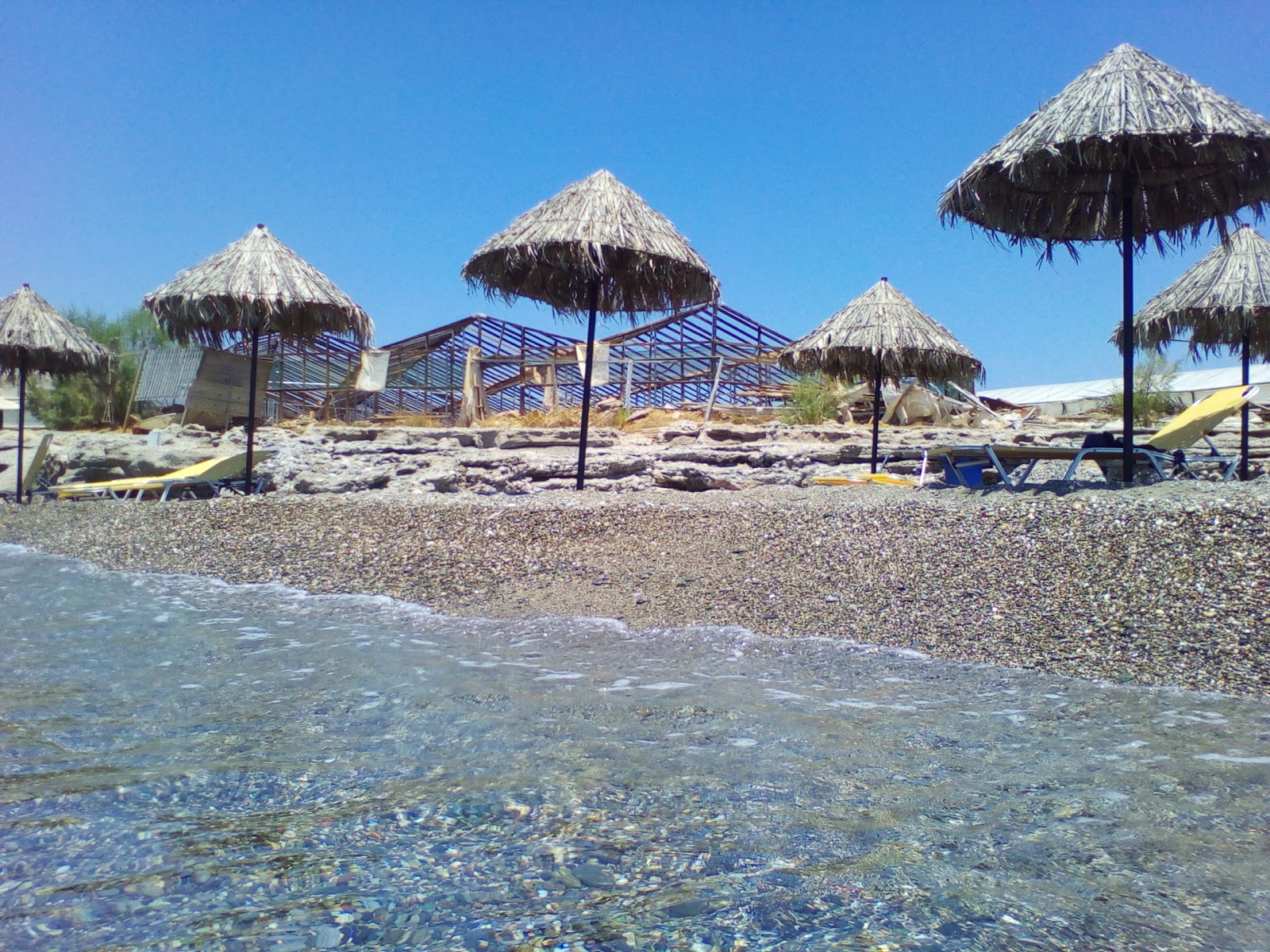 Photo of Koutsoureli beach with turquoise pure water surface