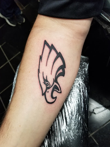 Explore tattoo ideas for top of foot, creative tattoo ideas in Erie, available at EliKingInk