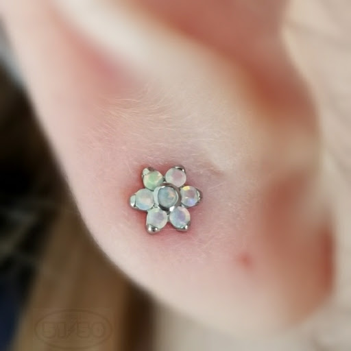 Explore collar tattoo ideas, creative tattoo ideas in Kearney, available at Studio 5150 Piercing & Fine Jewelry