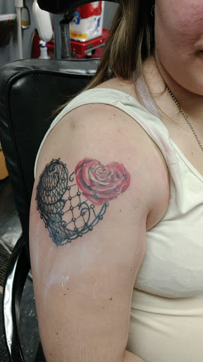 Explore armband tattoo ideas for men, creative tattoo ideas in Kalamazoo, available at SouthPointe Ink - Tattoos and Piercings