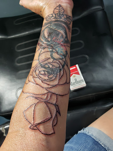 Explore simple silver lining tattoo ideas, creative tattoo ideas in Glendale, available at Bad Intentions Tattoo, Piercing & Supply, LLC