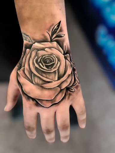 Find sapphic tattoo ideas for your next unique tattoo in West Union at Status Tattoo