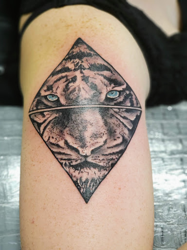 Find tattoo skull ideas for your next unique tattoo in Bowling Green at The Mad Tatter, L.L.C.