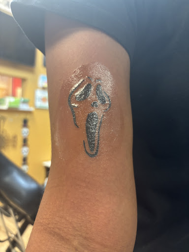 Find lipstick tattoo ideas for your next unique tattoo in Jonesboro at Hollyweird Tattooz