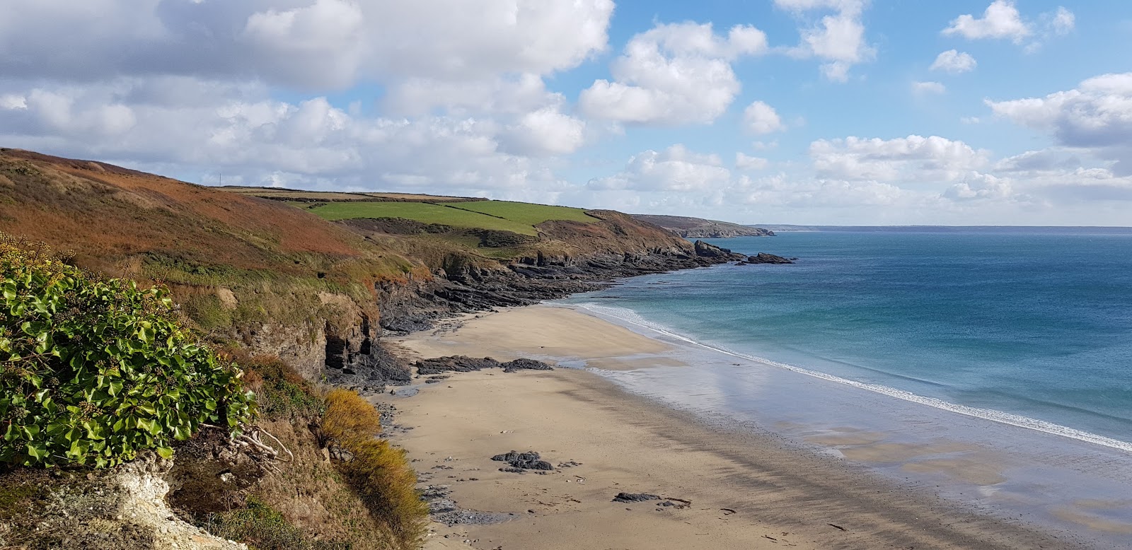 Photo of Kenneggy Cove with turquoise pure water surface