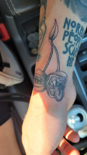 Explore tattoo ideas for initials, creative tattoo ideas in Orange, available at Empire Tattoo
