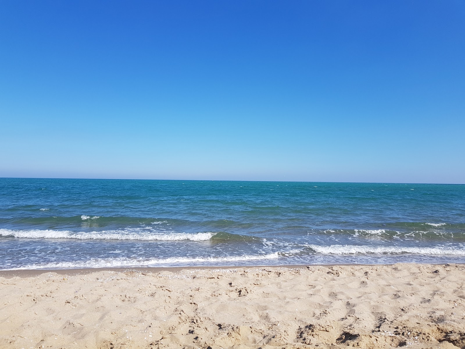 Fotografija Catania beach II z turkizna čista voda površino