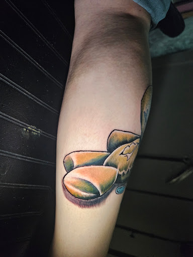 Explore roman numeral tattoo ideas for guys, creative tattoo ideas in Angola, available at Hoodlum Ink