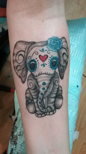 Explore checkered flag tattoo ideas, creative tattoo ideas in Lufkin, available at Blue Lotus Tattoo & Piercing