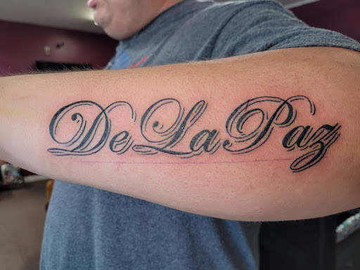 Explore warlock tattoo ideas, creative tattoo ideas in Angola, available at Hoodlum Ink