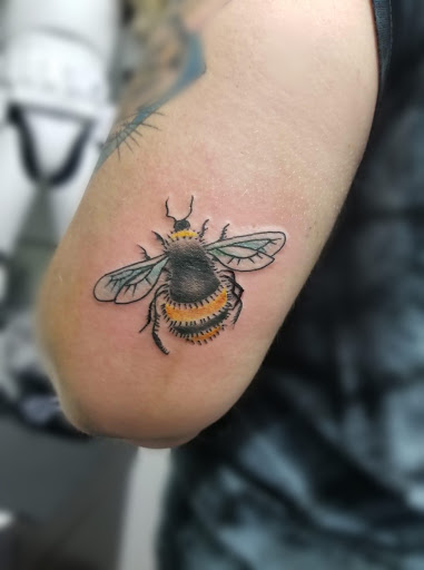 Explore middle finger tattoo ideas, creative tattoo ideas in Mc Kees Rocks, available at Exile Ink