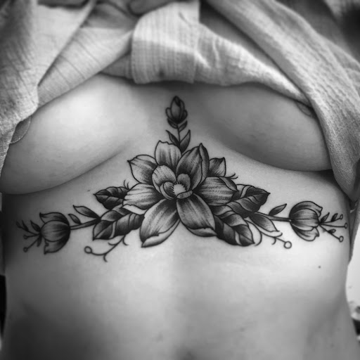 Explore cute thigh tattoo ideas, creative tattoo ideas in Derby, available at Green Panther Tattoo