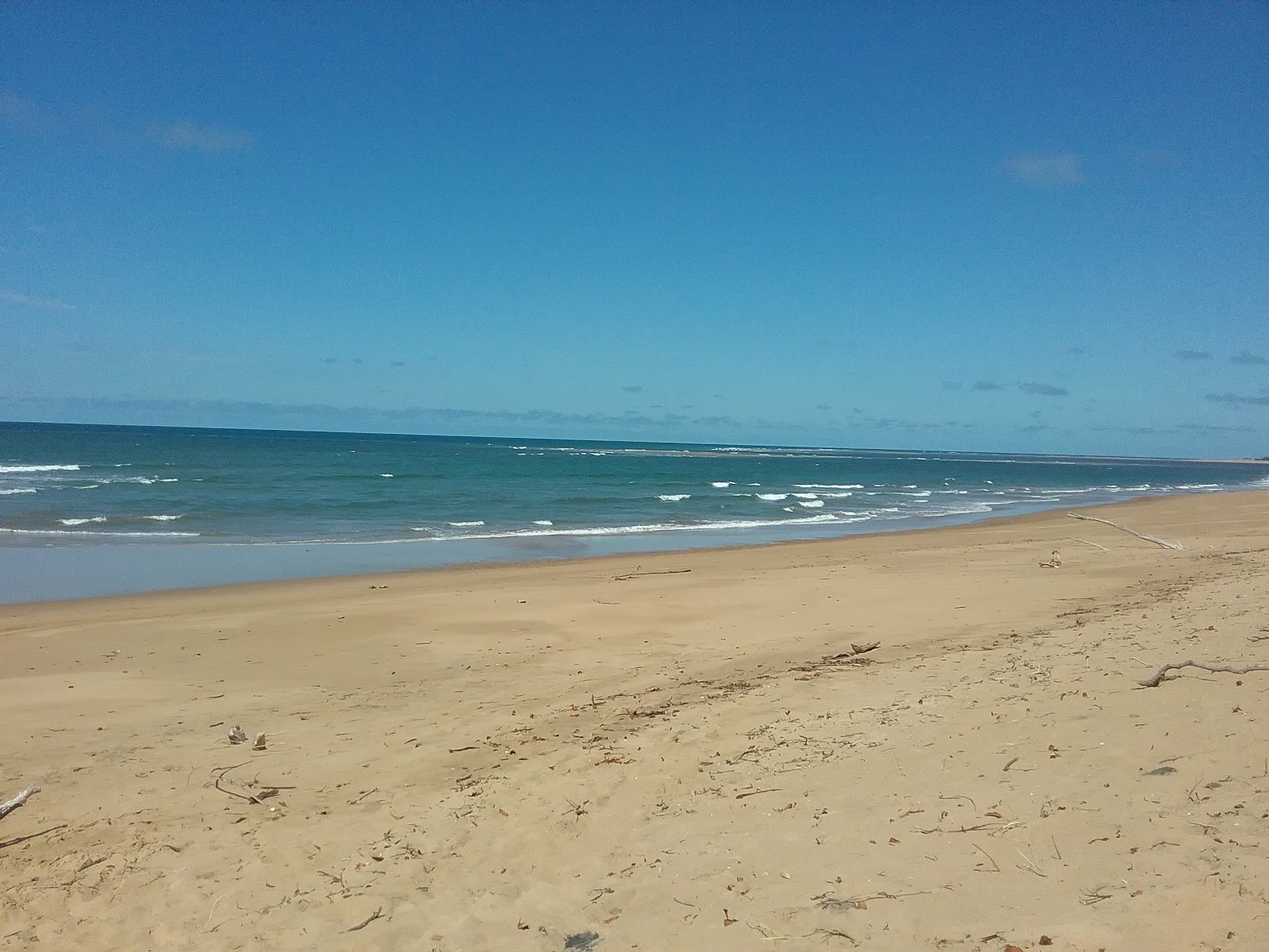 Fotografija Rules Beach z svetel pesek površino