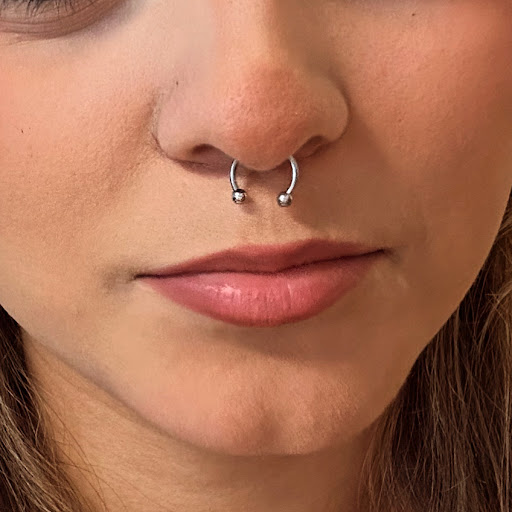 Explore watercolor flower tattoo ideas, creative tattoo ideas in Round Rock, available at Piercings by Toni