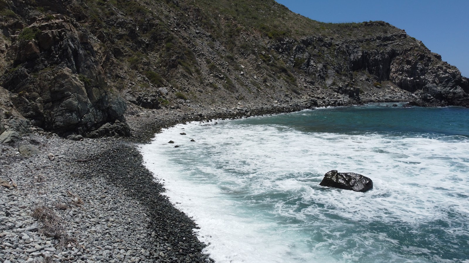 Foto av Playa renacer med stenar yta