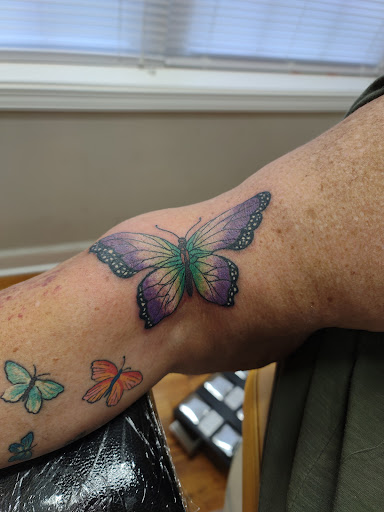 Explore mens face tattoos ideas, creative tattoo ideas in East Bend, available at Queen Bee Piercing and Tattoo