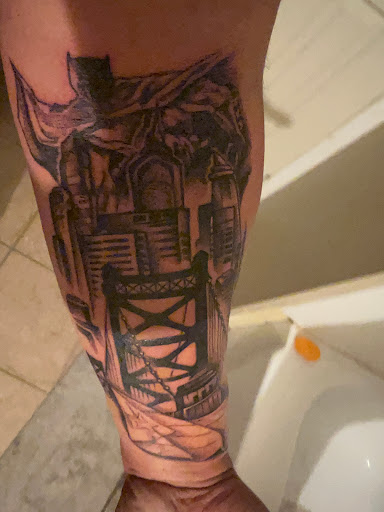 Explore minimalist dog tattoo ideas, creative tattoo ideas in Lafayette, available at Sacred Apple Tattoo