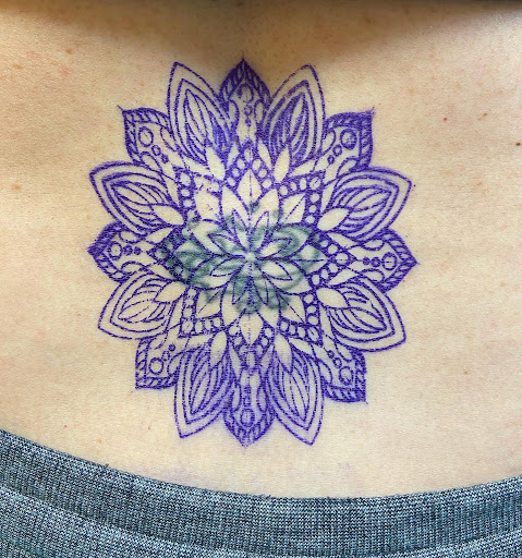 Find tattoos in between breast ideas for your next unique tattoo in Marietta at Lure Tattooing & Piercing LLC
