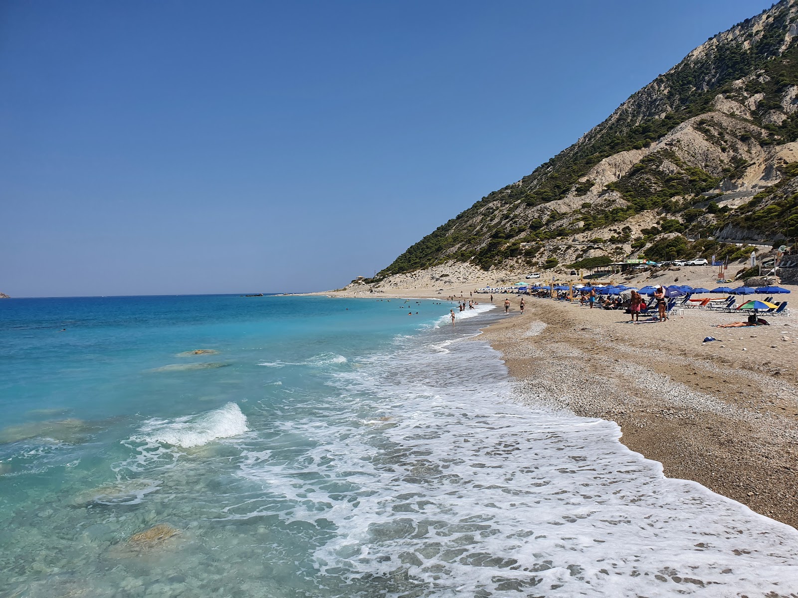 Photo of Gialos beach with long straight shore