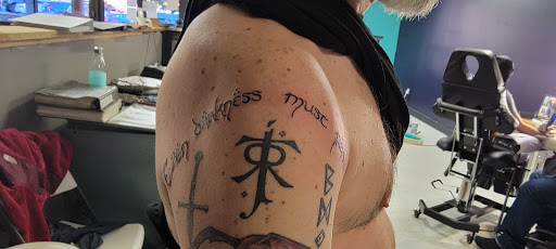 Explore men's back shoulder tattoo ideas, creative tattoo ideas in Cherokee, available at Indian Ink Tattoo Studio