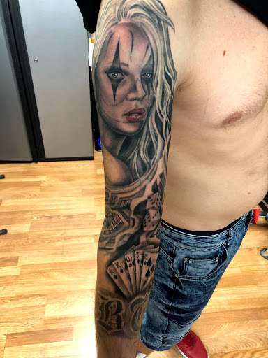 Explore front thigh tattoo ideas for women, creative tattoo ideas in Sarasota, available at SEVEN SINS Tattoo Studio