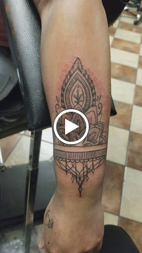 Explore bicep tattoo ideas for men, creative tattoo ideas in Bakersfield, available at Monster Ink