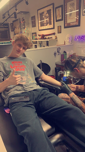 Explore street sign tattoo ideas, creative tattoo ideas in Jupiter, available at Jupiter Ink Studio