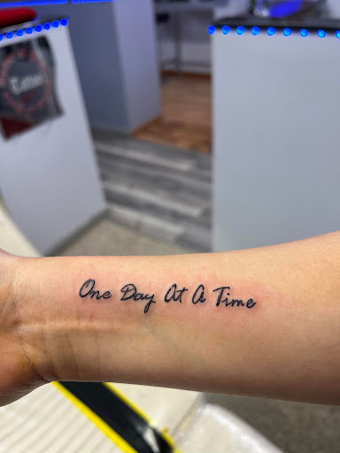 Explore throat tattoo ideas for men, creative tattoo ideas in Rockford, available at House Of Pain Tattoo co.