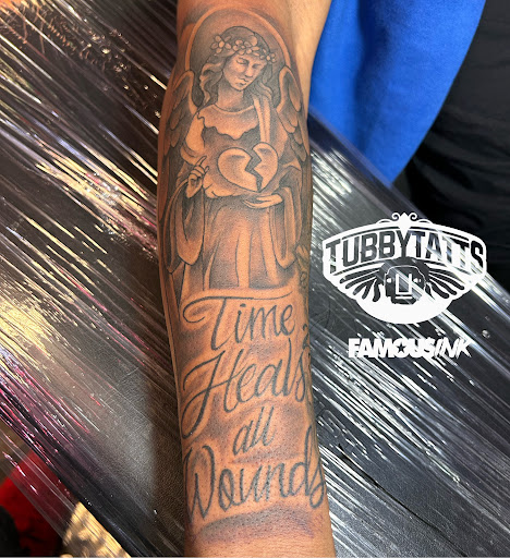 Explore camera tattoo ideas, creative tattoo ideas in Hammond, available at Famous Ink, Inc.