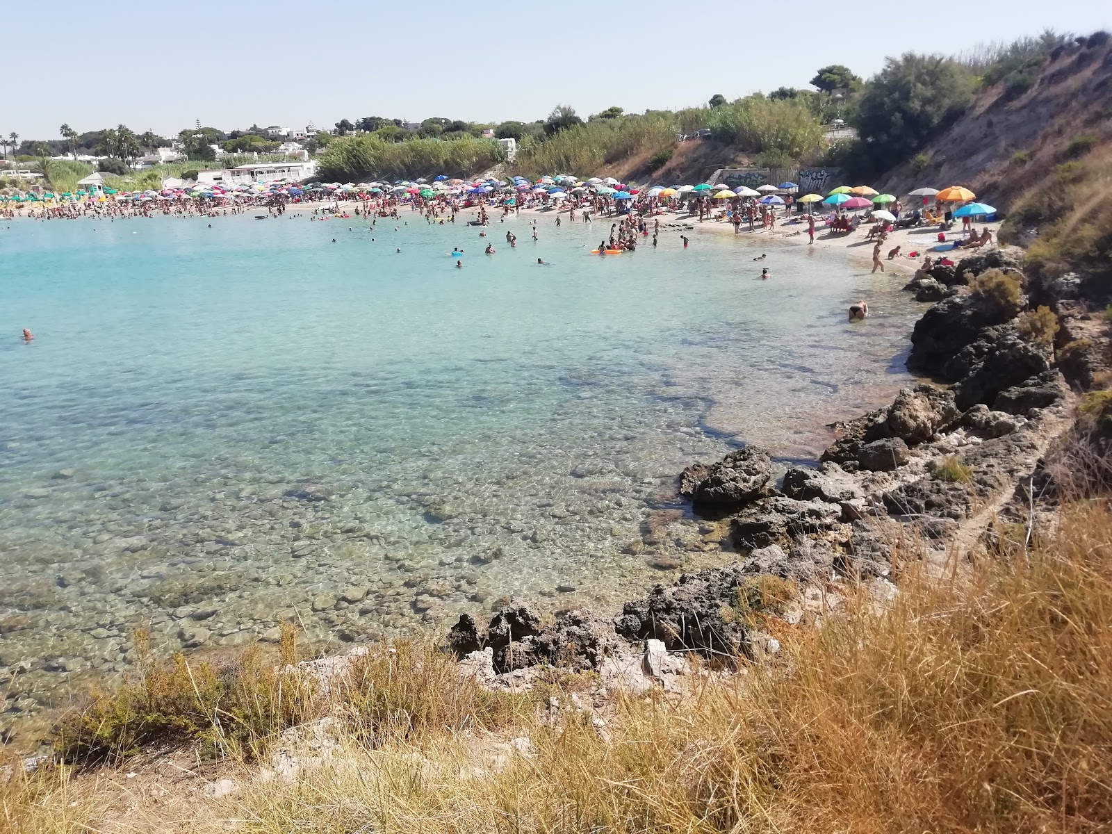 Foto van Canneto Strand met hoog niveau van netheid