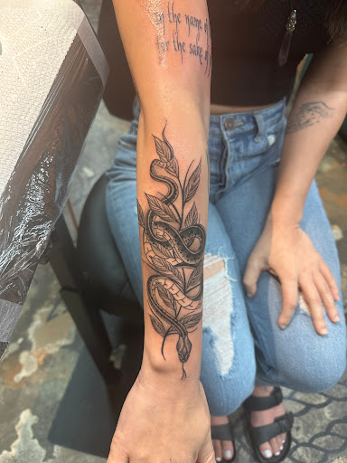 Explore throat tattoo ideas for females, creative tattoo ideas in Fort Lauderdale, available at Rock-A-Billy Tattoo & Piercing Studio