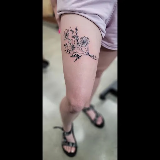 Explore rose tattoo cover up ideas, creative tattoo ideas in Lees Summit, available at The Cherry Bomb Tattoo Co.