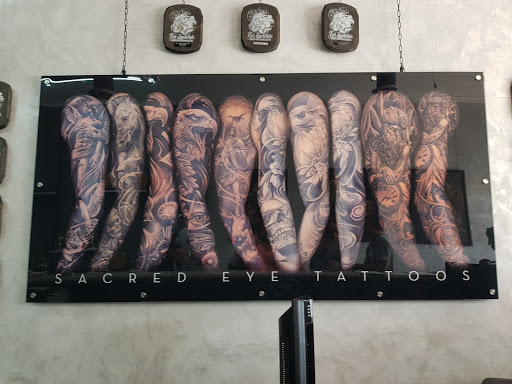 Explore lion forearm tattoo ideas, creative tattoo ideas in Hollywood, available at Sacred Eye Tattoos