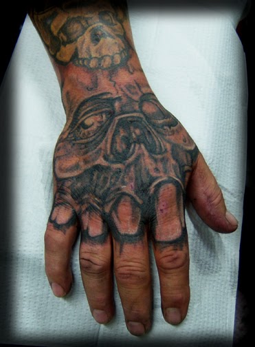 Explore middle finger tattoo ideas, creative tattoo ideas in Knoxville, available at True Blue Electric Tattoo