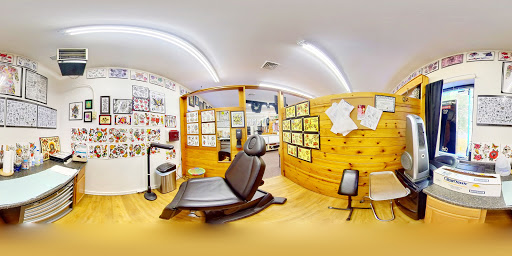 Explore cover up tattoo ideas for upper arm, creative tattoo ideas in Stroudsburg, available at RockN Willys Tattoo & Piercing