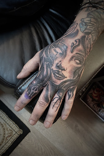 Explore hand mens tattoo ideas, creative tattoo ideas in Fairfax, available at Comes A Time Tattoo