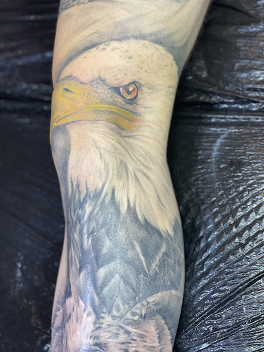 Explore american traditional elbow tattoo ideas, creative tattoo ideas in El Paso, available at Art of Ink Studios