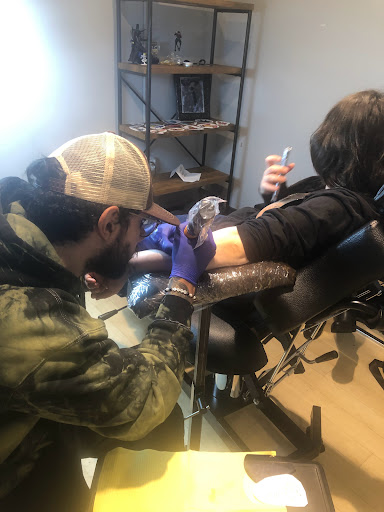 Explore photographer tattoo ideas, creative tattoo ideas in Fort Wayne, available at Grade A Tattoos and Body Piercing