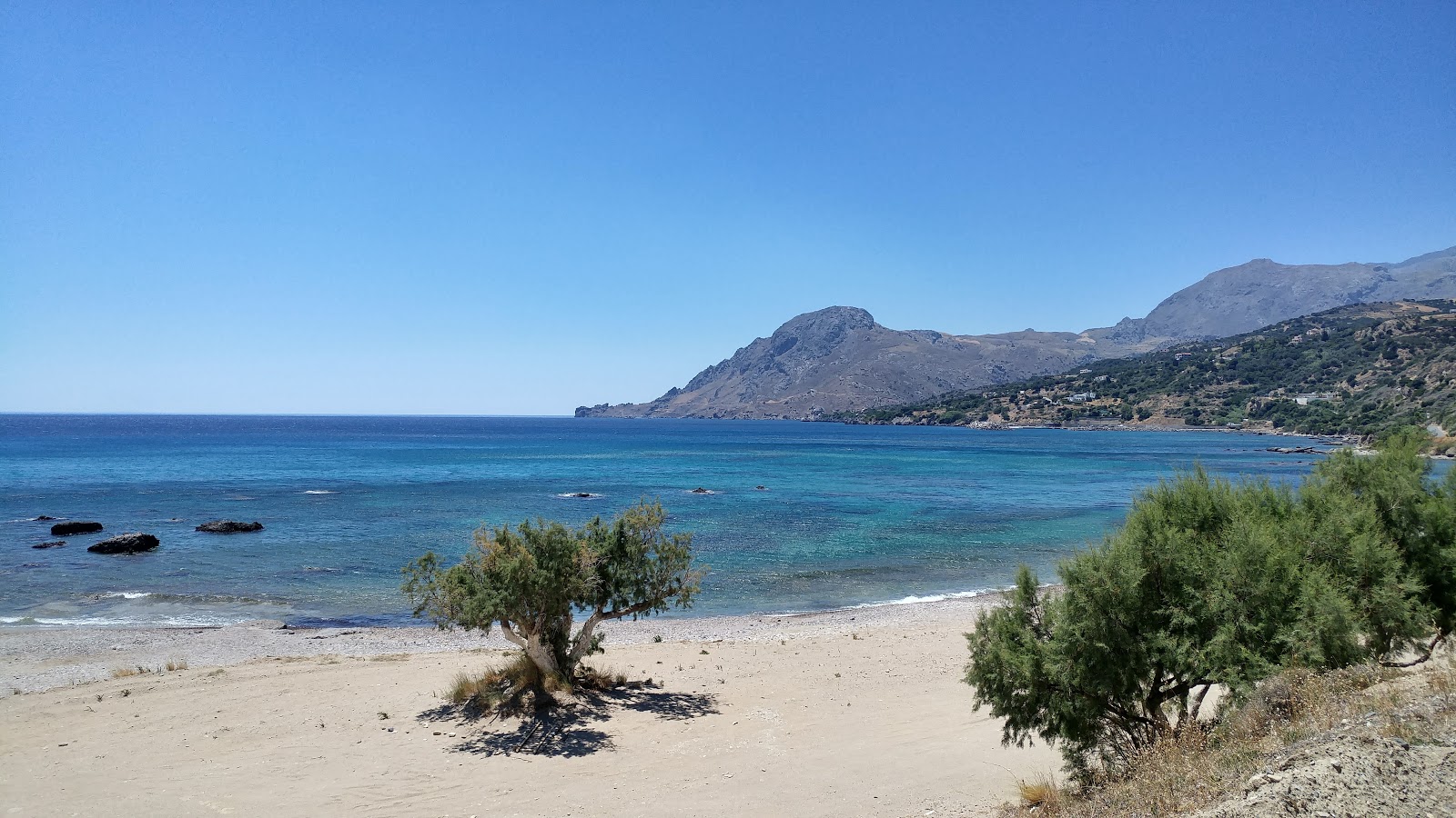 Photo of Skinos beach with turquoise pure water surface