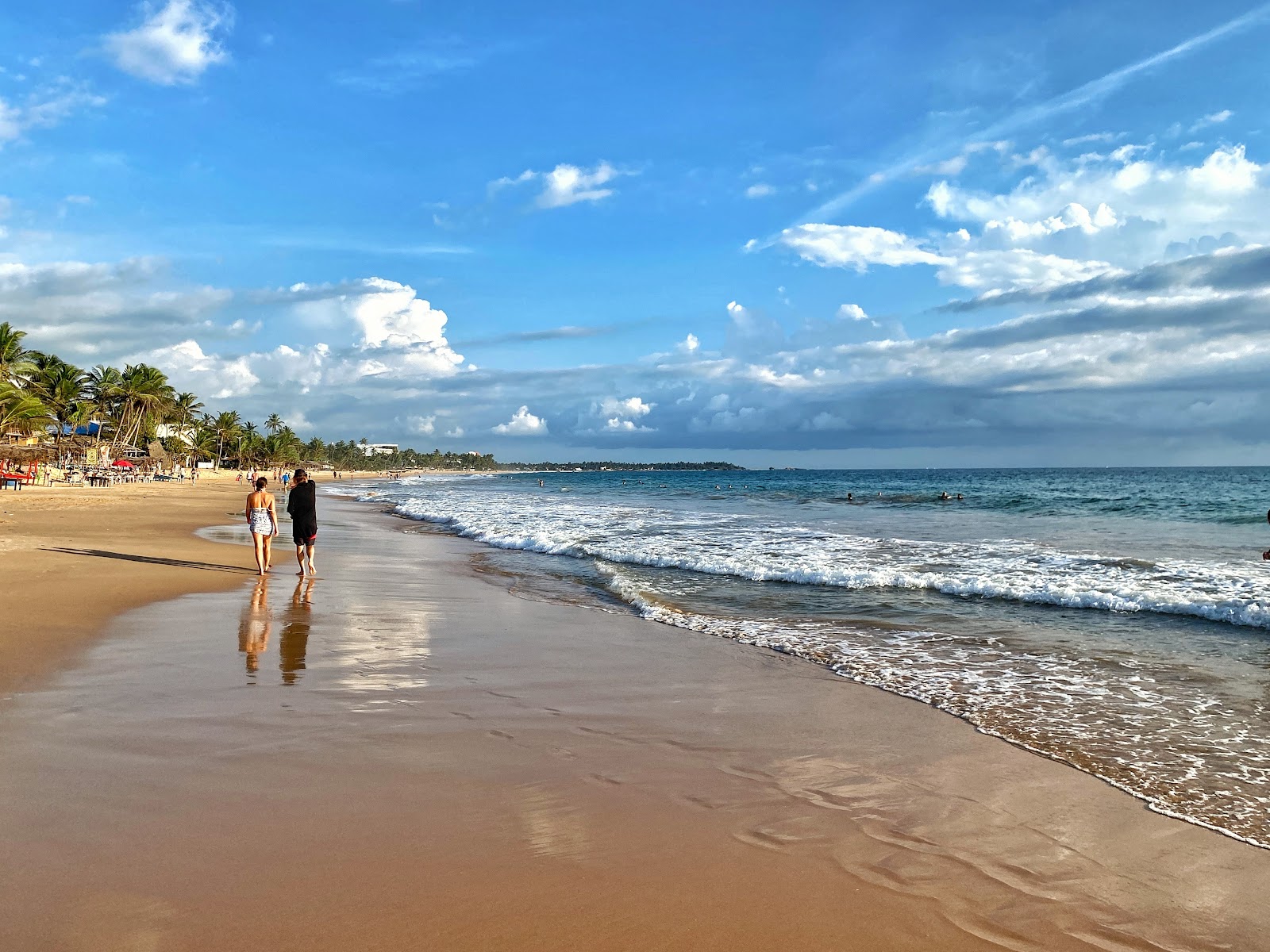 Foto de Narigama Beach con arena beige superficie