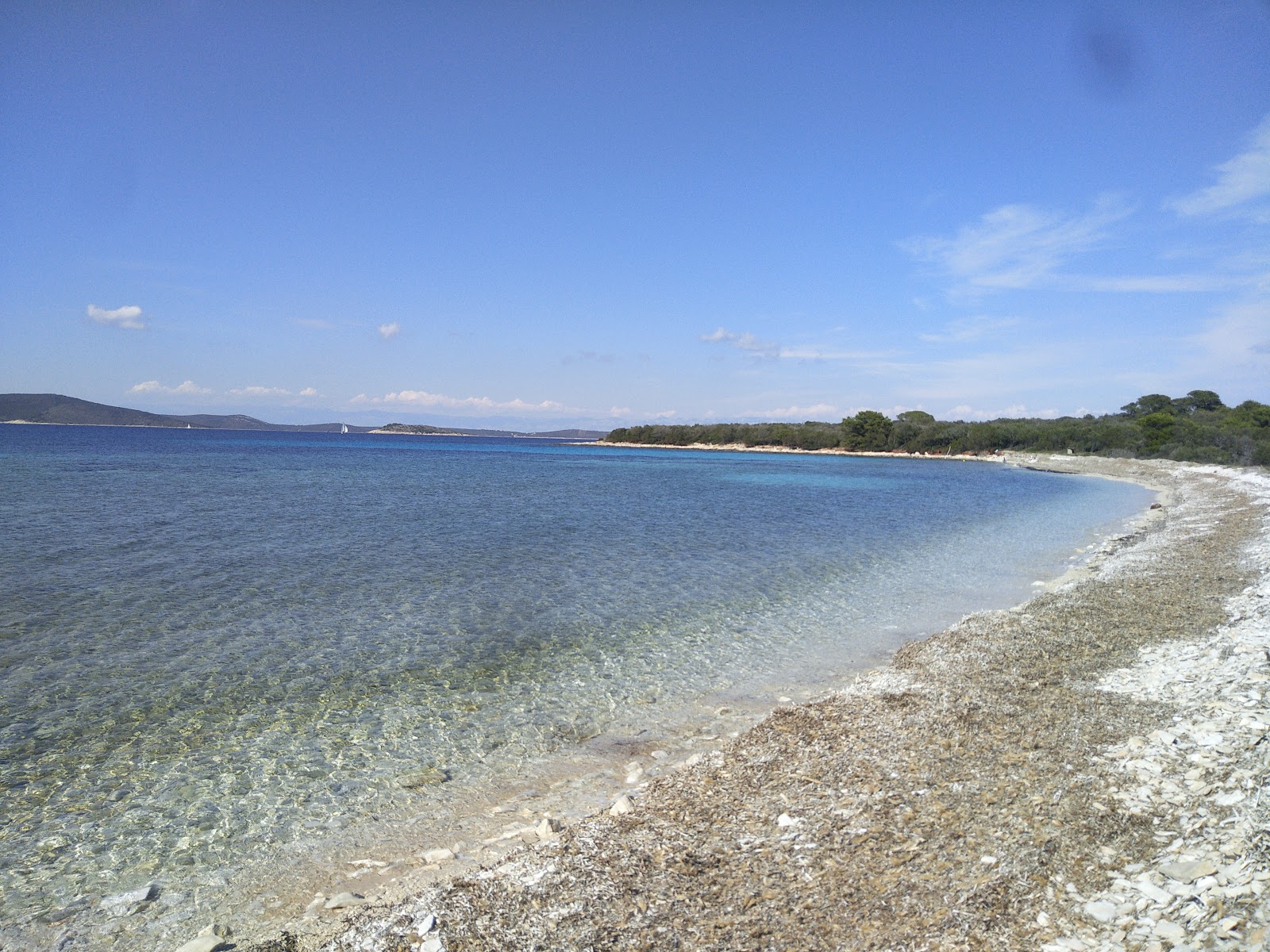 Foto von Natural Bridge beach mit beiger kiesel Oberfläche