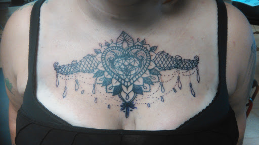 Explore black flower tattoo ideas, creative tattoo ideas in La Crosse, available at La Crosse Tattoo