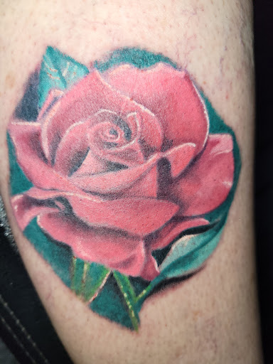 Explore lucky penny tattoo ideas, creative tattoo ideas in Angola, available at Hoodlum Ink