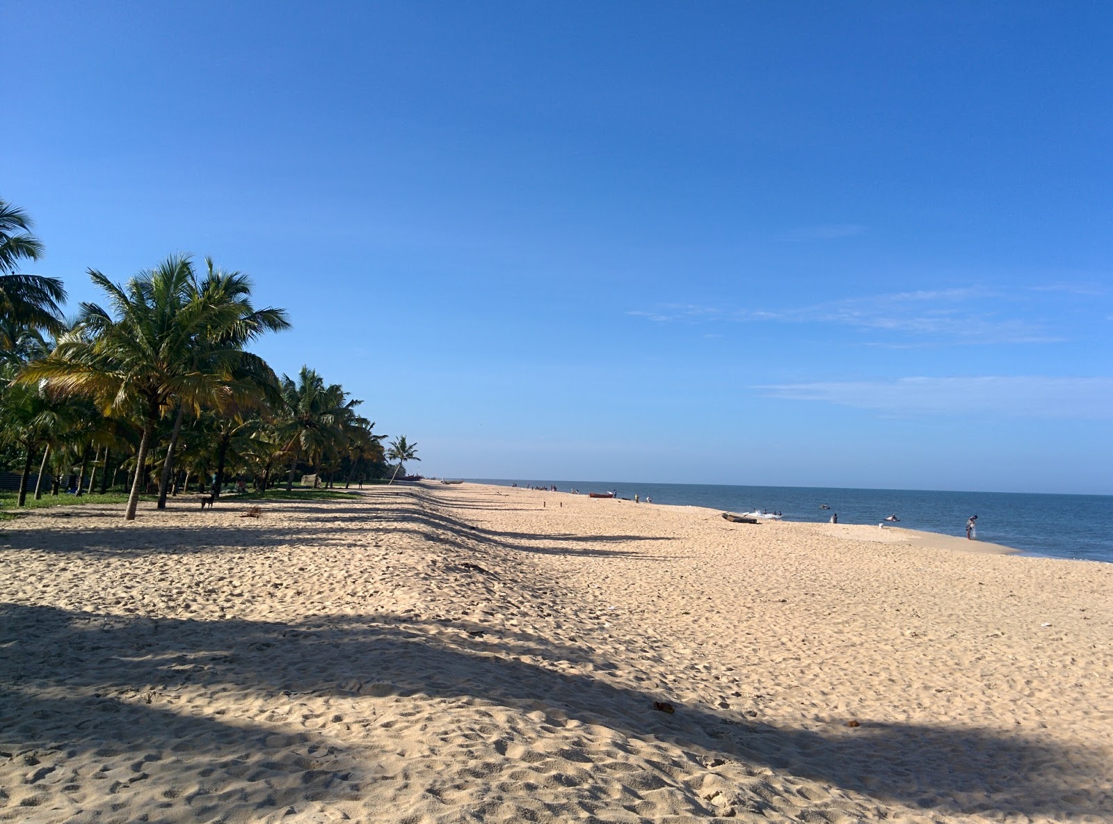 Photo de Marari Beach avec sable lumineux de surface