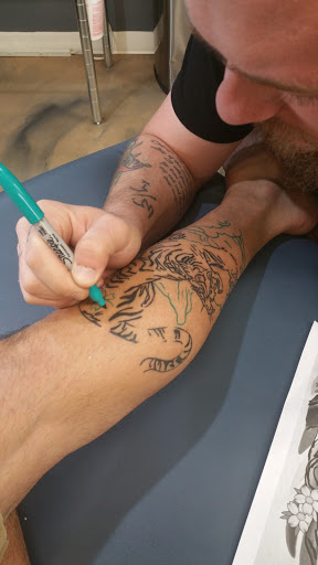 Explore back hand tattoo ideas, creative tattoo ideas in Abilene, available at Sacred Art