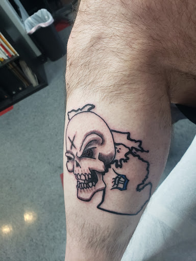 Explore thigh tattoo ideas for men, creative tattoo ideas in Saint Paul, available at Black Coffin Tattoo